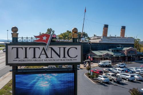 a sign for a theatre in a parking lot at 5Bd5B Escape Cabin with 2 HotTubs, Thtr &Game Rm,1mi to the Parkway! 4mi to Dollywood - Spring Deal in Pigeon Forge