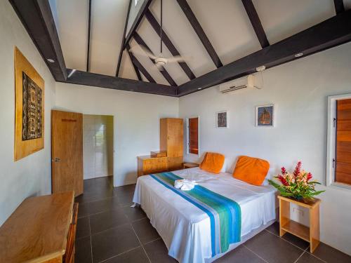 a bedroom with a bed in a room at Daku Resort in Savusavu