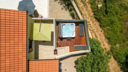 an overhead view of a house with a pool at Holiday house Toš-Vila with heated pool in Vrbnik