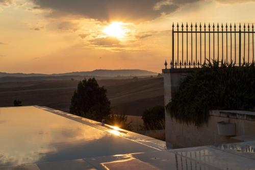 a view of the sunset from the roof of a house at Villa Matera in Matera
