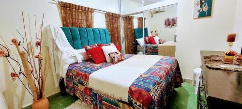 En eller flere senge i et værelse på Mi otro hogar