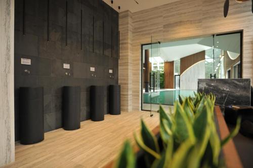 a living room with a pool and a glass wall at Crona SPA Karpaty in Skhidnitsa
