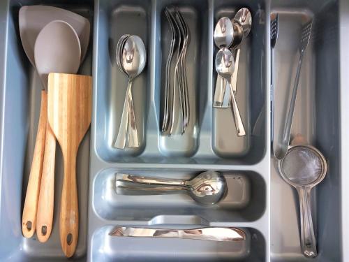 a drawer filled with utensils and silver utensils at Li's Apartment in Kottawa