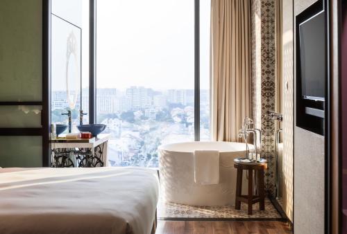 Ένα ή περισσότερα κρεβάτια σε δωμάτιο στο Hotel Indigo Singapore Katong by IHG