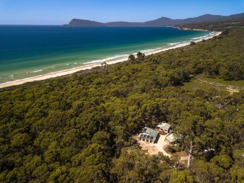 an aerial view of a house and the beach at Three Little Pigs Escape - MAIN HOUSE ONLY in South Bruny