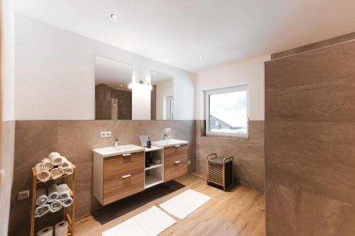 a bathroom with a sink and a mirror at Sunny Mountain in Münster