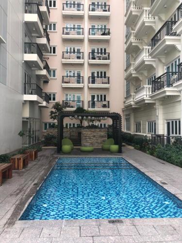 an empty swimming pool in front of a building at Lafayette Park Square Condominium Megaworld in Iloilo City