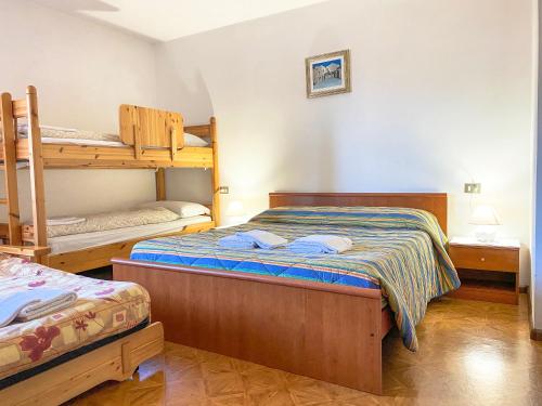 Posteľ alebo postele v izbe v ubytovaní Appartamento l'edera