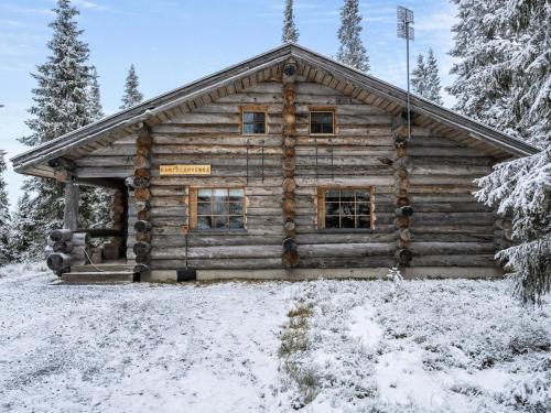 a log cabin in the snow at Holiday Home Kantolan veska by Interhome in Ruka