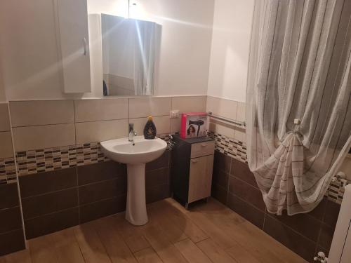 a bathroom with a sink and a mirror at La Zagara home in Villabate