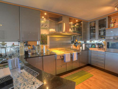 a kitchen with stainless steel appliances and a counter top at Apartment Emeraudes by Interhome in Anzère