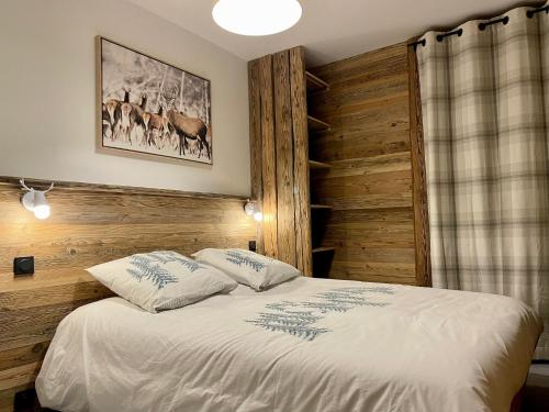Кровать или кровати в номере Chamallow - appart 4-6 places rénové - cosy et confort !
