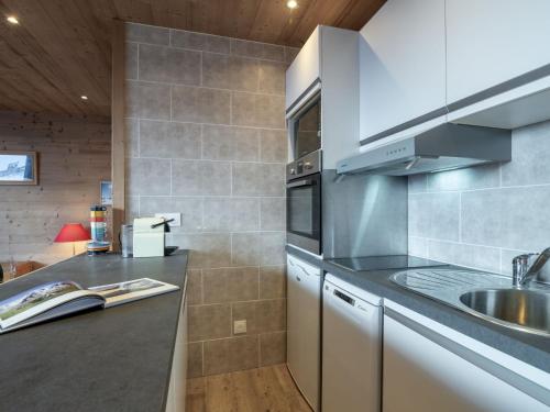 a kitchen with a sink and a counter top at Apartment Les Genepis-5 by Interhome in Tignes