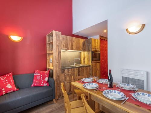 a dining room with a table and a couch at Apartment Rond Point des Pistes - Val Claret-20 by Interhome in Tignes