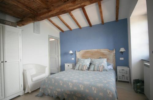 Postel nebo postele na pokoji v ubytování La Villa di Augusto