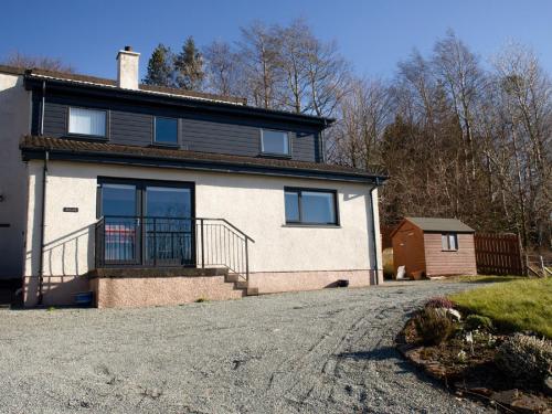a house with a driveway in front of it at Villa Solas by Interhome in Kensaleyre