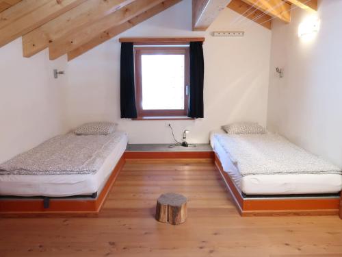 Postel nebo postele na pokoji v ubytování Apartment Ryad C by Interhome