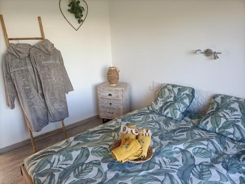 a bedroom with a bed with a stuffed animal on it at Cocoon inn&Spa in Saint-Saturnin-les-Avignon