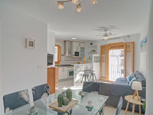 a living room and kitchen with a table and a couch at Apartment Pont del Moncau by Interhome in Altea