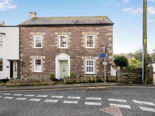 an old brick house on the side of a street at Holiday Home Cherry Orchard House by Interhome in Mevagissey