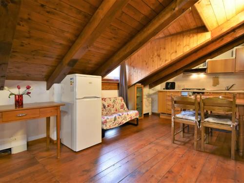 A kitchen or kitchenette at Studio Albergo Diffuso - Cjasa de Pagnocca by Interhome