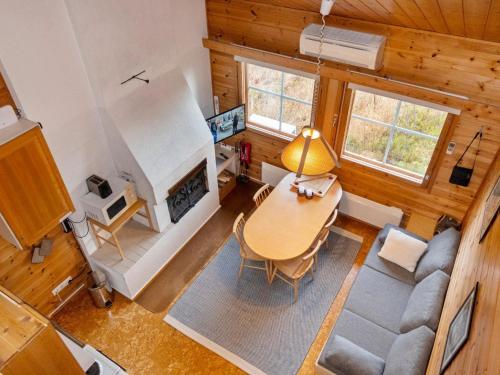 an overhead view of a living room with a table and a fireplace at Holiday Home Luppotupa by Interhome in Syöte