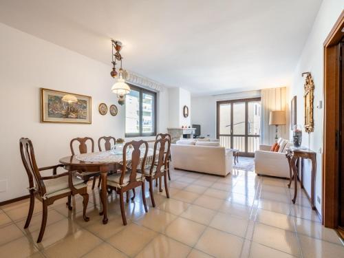 a dining room and living room with a table and chairs at Apartment da Nuccia by Interhome in Omegna