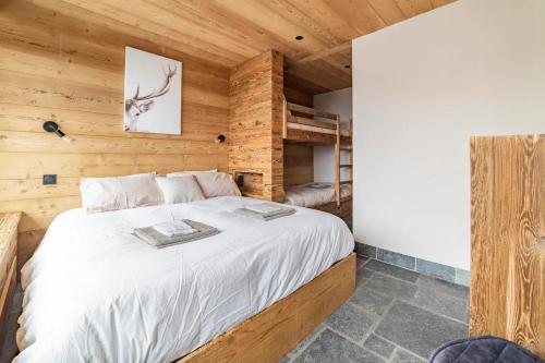 Cama o camas de una habitación en Cocon au pied des pistes de ski du Mont-d'Arbois