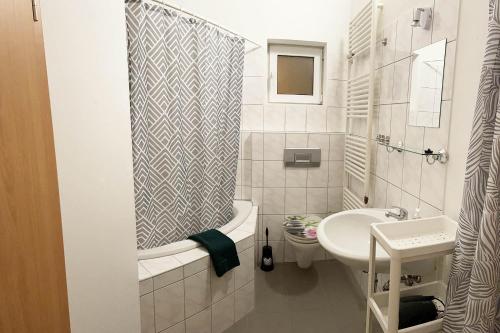 a small bathroom with a sink and a toilet at Work & Stay Apartments in Euskirchen in Euskirchen