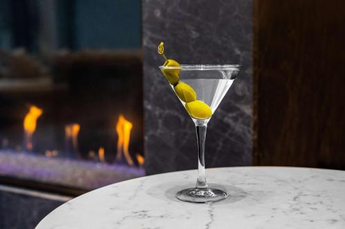 a martini glass with lemons on top of a table at Hyatt Regency Morristown in Morristown