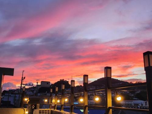 a train yard with a sunset in the background at Leehakjang guesthouse in Mokpo