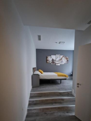 a bedroom with a bed with a yellow blanket at Malasaña Dreams S,L in Madrid