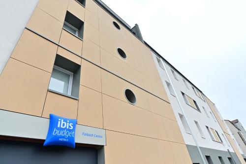 a building with a sign on the side of it at ibis budget Forbach Centre in Forbach