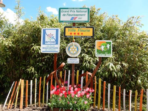 a bunch of signs in front of a fence at Forest Retreat in Vosges in Hanviller