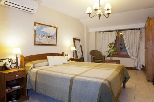 Postel nebo postele na pokoji v ubytování Hotel Triskel