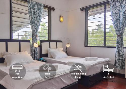 two beds in a room with two windows at Jalan Kuhara 300 mbps Detach Bungalow Family Fun BBQ Homestay in Tawau