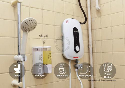 an iphone holder on the wall of a bathroom at Jalan Kuhara 300 mbps Detach Bungalow Family Fun BBQ Homestay in Tawau