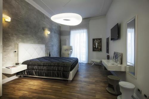 Ένα ή περισσότερα κρεβάτια σε δωμάτιο στο Ferrari Suite
