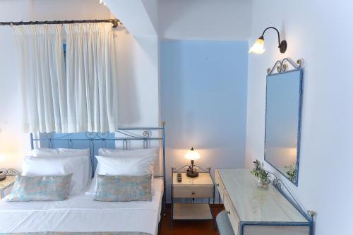 Ένα ή περισσότερα κρεβάτια σε δωμάτιο στο Vathi Hotel Apartment Hotel