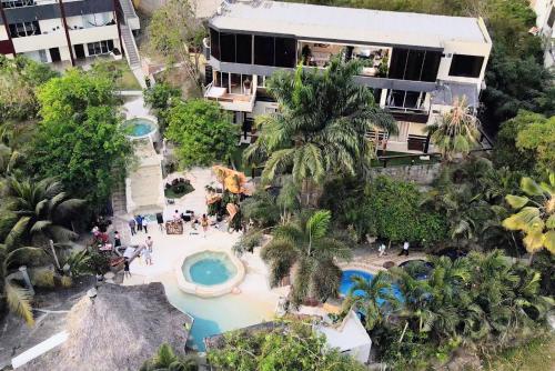 an aerial view of a resort with a swimming pool at ME Hotel & Villas - Montañita Estates in Montañita