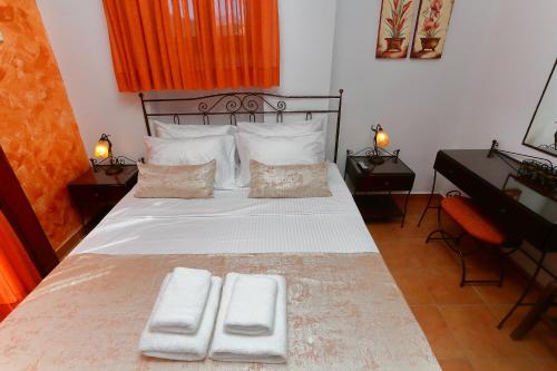 Ένα ή περισσότερα κρεβάτια σε δωμάτιο στο Vathi Hotel Apartment Hotel