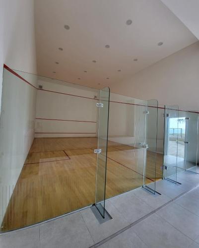 a tennis court with a net in a room at Bali Residence Impian Raudah in Melaka