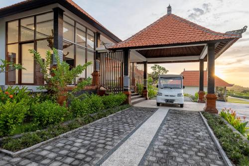 a truck parked in front of a house at Semabu Hills Hotel Nusa Penida in Nusa Penida