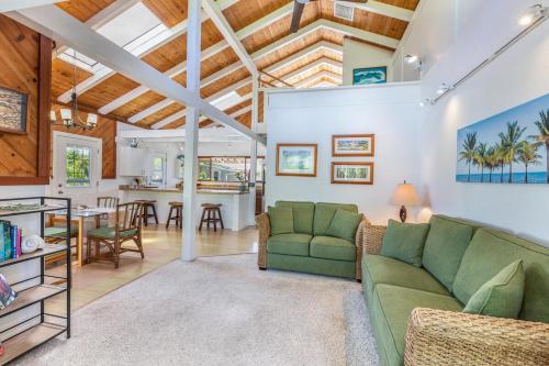 a living room with a couch and a table at Hanalei Palms home in Hanalei