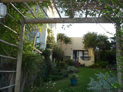 a garden view from the outside of a house at A1 Kynaston Guest House bed and breakfast or self catering in Jeffreys Bay