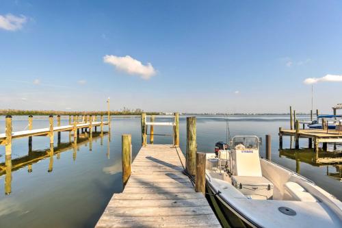 a boat is docked next to a dock at Little Gasparilla Home Walk to Beaches! in Placida