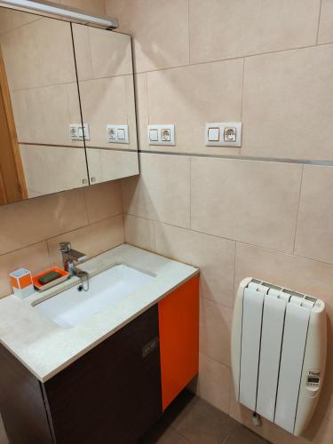 a bathroom with a sink and a mirror at Estrella azul/ Blue star in Puerto de Sagunto