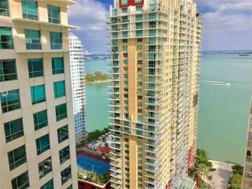 an aerial view of two tall buildings next to the water at Absolutely Beautiful 1 BR Paradise with a Huge balcony in Miami