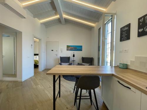an office with a table and chairs in a room at SUN Luxury Apartment in Centro Storico in Chiavari