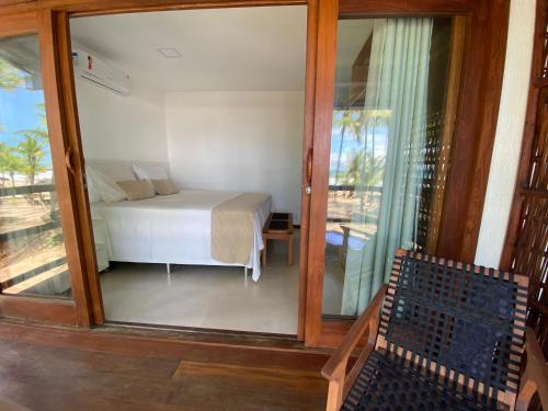 Katil atau katil-katil dalam bilik di 105 Condo Dreamland Apts BeachFront - Taipu de Fora